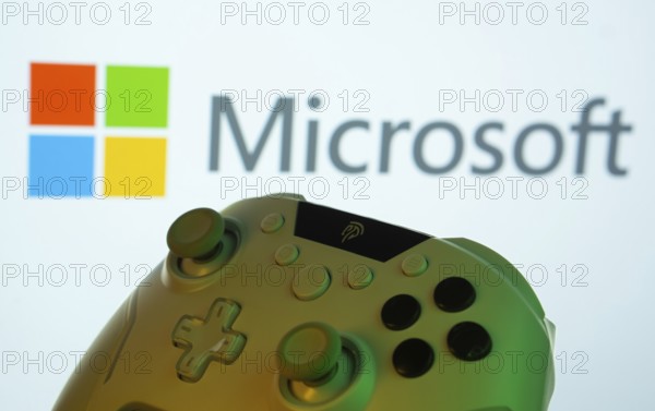 Dhaka, Bangladesh- 14 Nov 2025: A close-up of a gamepad with the Microsoft seen on screen in the