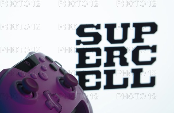 Dhaka, Bangladesh- 14 Nov 2025: A close-up of a gamepad with the Supercell seen on screen in the
