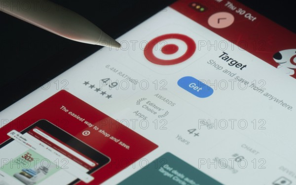 Dhaka, Bangladesh- 30 Oct 2025: Target app on a iPad screen with a pen pointing at the install