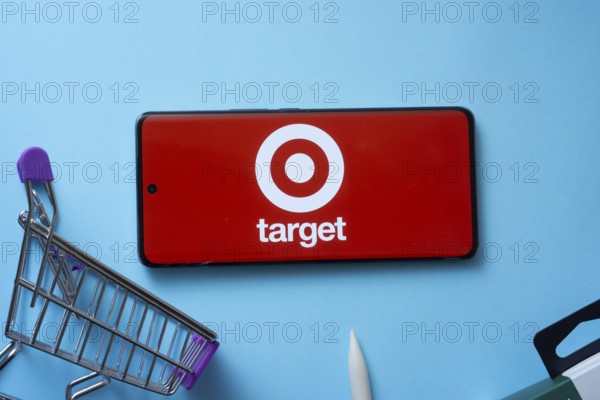 Dhaka, Bangladesh- 03 July 2025: Smartphone displaying Target logo with shopping cart on a blue