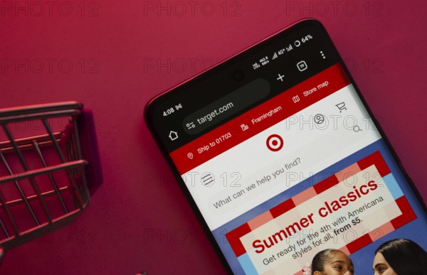 Dhaka, Bangladesh- 23 June 2025: A smartphone displaying the Target website with a shopping cart is