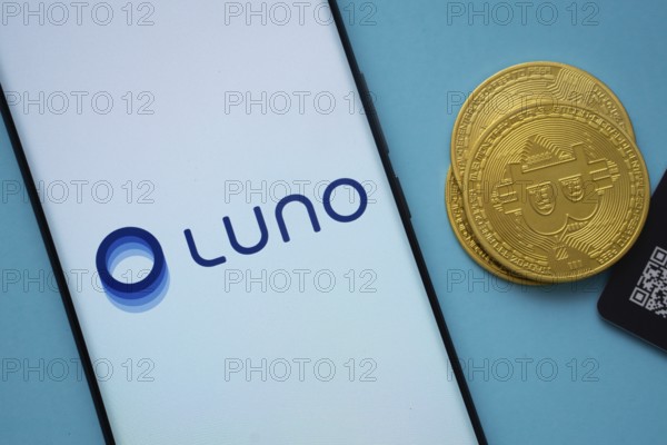 Dhaka, Bangladesh- 03 Sep 2025: Luno logo on smartphone screen near Bitcoin coin and QR code on
