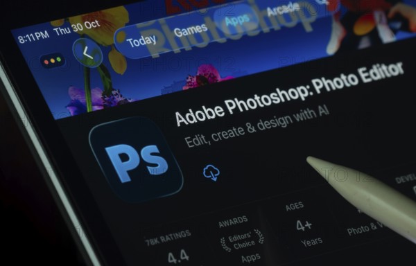 Dhaka, Bangladesh- 30 Oct 2025: Adobe Photoshop app displayed on a iPad screen in dark mode with a