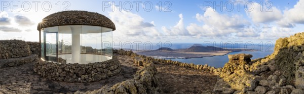 Stairway and viewing platform at the Mirador del Río viewpoint, in the evening light with sun