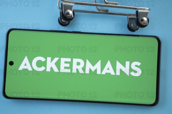 Dhaka, Bangladesh- 03 July 2025: Smartphone screen showing the Ackermans logo with shopping cart