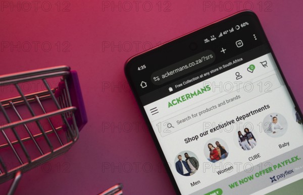 Dhaka, Bangladesh- 23 June 2025: A smartphone displaying the Ackermans website with a shopping cart