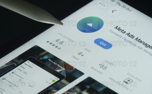 Dhaka, Bangladesh- 30 Oct 2025: meta ads manager app on a iPad screen with a pen pointing at the