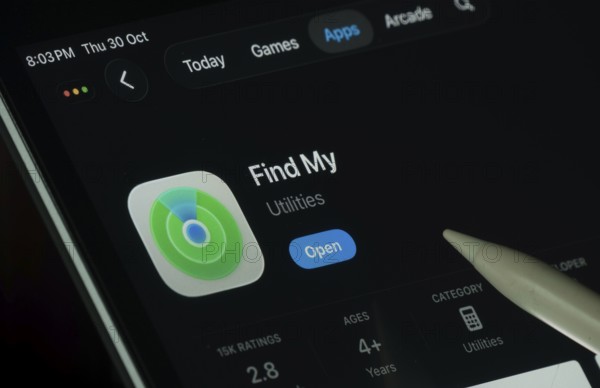 Dhaka, Bangladesh- 30 Oct 2025: Apple Find My app displayed on a iPad screen in dark mode with a