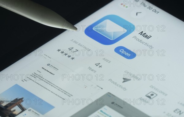 Dhaka, Bangladesh- 30 Oct 2025: Apple Mail app on a iPad screen with a pen pointing at the install