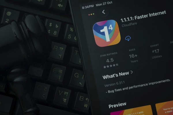 Dhaka, Bangladesh- 28 Oct 2025: An iPad displaying the 1.1.1.1 VPN app against a judge's gavel and