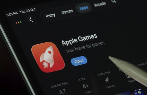 Dhaka, Bangladesh- 30 Oct 2025: Apple Games app displayed on a iPad screen in dark mode with a