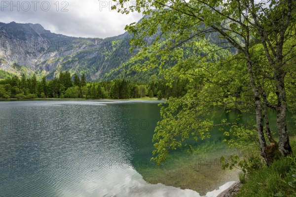 Landscape of Lake Offensee after rain when the sun comes through the clouds in spring,