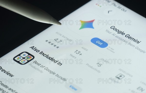 Dhaka, Bangladesh- 30 Oct 2025: Google Gemini app on a iPad screen with a pen pointing at the