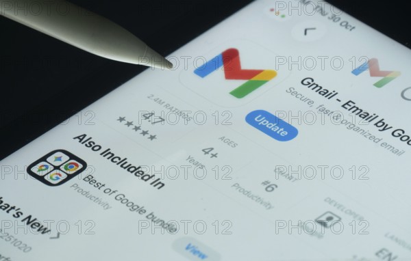 Dhaka, Bangladesh- 30 Oct 2025: Gmail app on a iPad screen with a pen pointing at the install
