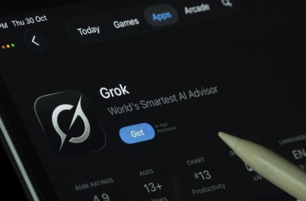 Dhaka, Bangladesh- 30 Oct 2025: Grok Ai app displayed on a iPad screen in dark mode with a digital