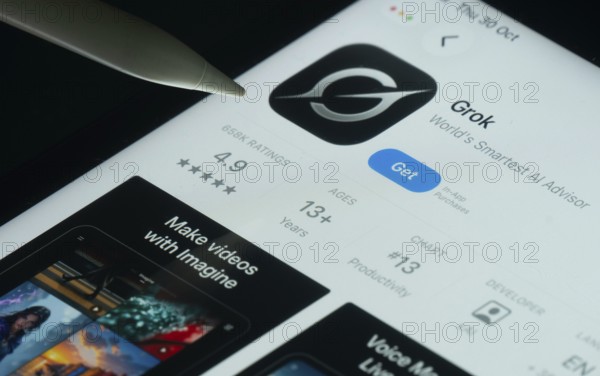 Dhaka, Bangladesh- 30 Oct 2025: Grok Ai app on a iPad screen with a pen pointing at the install