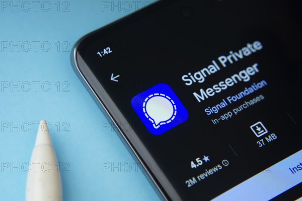 Dhaka, Bangladesh- 29 May 2025: On a blue surface, a smartphone displays the Signal app within the