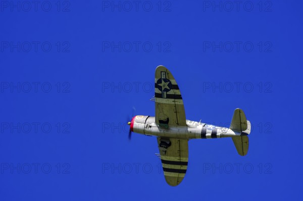 An RC model of a Republic P-47 Thunderbolt during a demonstration as part of an air show at the