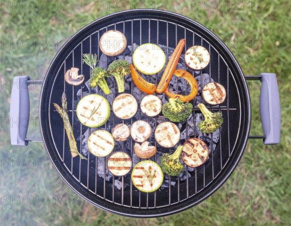 Cooking vegetables on grill outdoors, healthy lifestyle with healthy food, close up of grill with