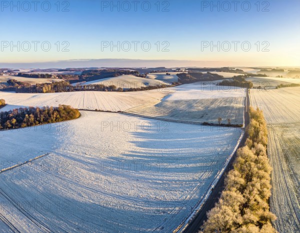 Bird Eye Perspective of Frost Covered Farmland. Seasonal Agricultural Scenery, winter and autumn