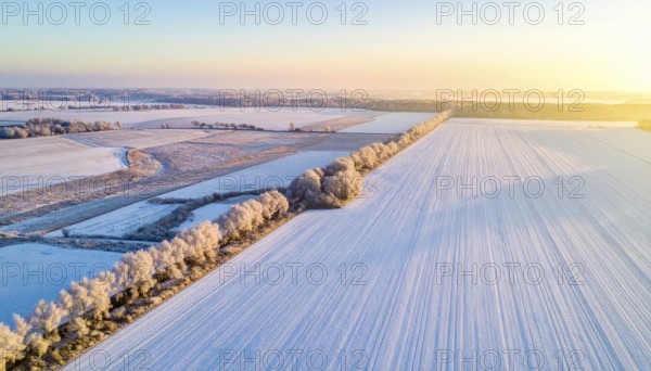 Bird Eye Perspective of Frost Covered Farmland. Seasonal Agricultural Scenery, winter and autumn