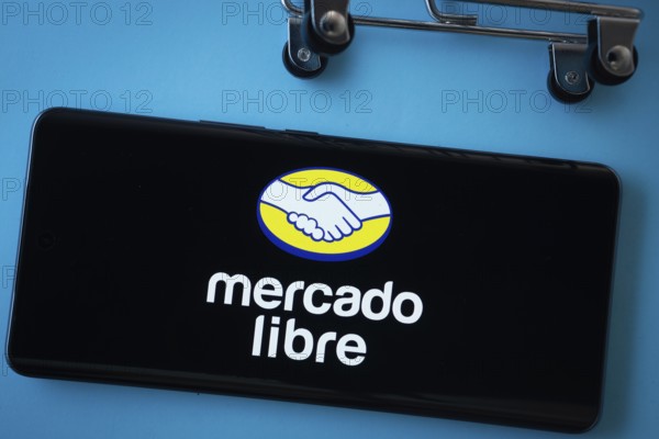 Dhaka, Bangladesh- 03 July 2025: Smartphone screen showing the Mercado Libre logo with shopping