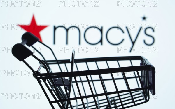 Dhaka, Bangladesh- 03 July 2025: Silhouette of a shopping cart in front of the Macy's logo,
