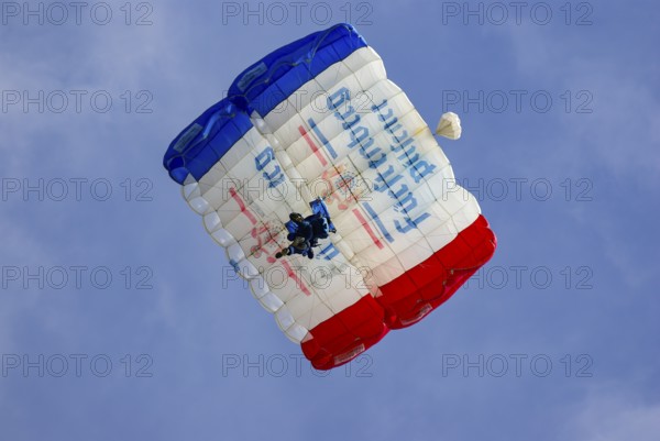 Two parachutists during an aerial acrobatic performance as part of an air show at the Rossfeld in