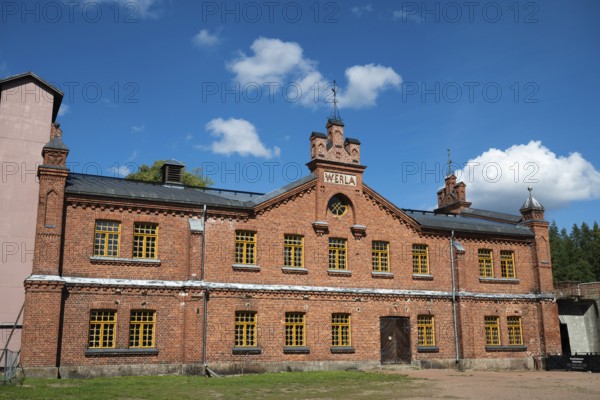 Brick façade with inscription Werla, former paper factory and mill for the production of groundwood