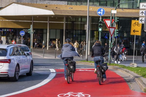 Cycle path, cycle lane, marked in red to draw the attention of motorists to the cycle path, between
