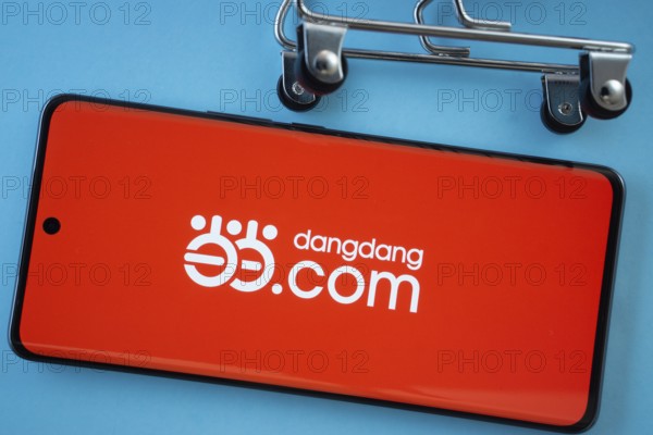 Dhaka, Bangladesh- 03 Oct 2025: Smartphone screen showing the Dangdang.com logo with shopping cart