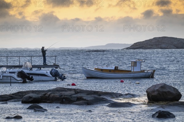 Small bay, archipelago, jetty with angler, Resö Island, Bohuslän, Skagerrak, Sotenäs, Västra