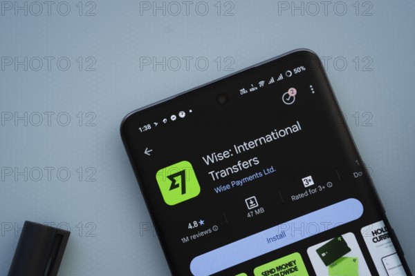 Dhaka, Bangladesh- 29 May 2025: On a blue surface, a smartphone displays the Wise app within the