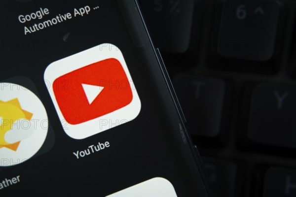 Dhaka, Bangladesh- 27 July 2025: Close-up of smartphone screen showing the youtube app icon with a