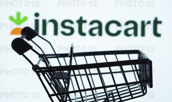 Dhaka, Bangladesh- 03 July 2025: Silhouette of a shopping cart in front of the Instacart logo,