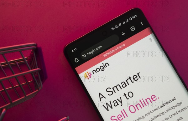 Dhaka, Bangladesh- 23 June 2025: A smartphone displaying the nogin website with a shopping cart is