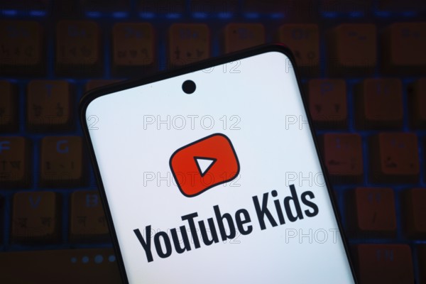 Dhaka, Bangladesh - 06 Sep 2025: The logo of Youtube kids is displayed on a smartphone screen