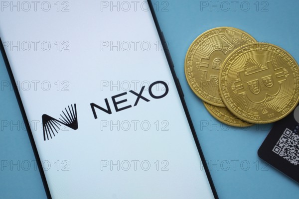 Dhaka, Bangladesh- 06 Sep 2025: Nexo logo on smartphone screen near Bitcoin coin and QR code on