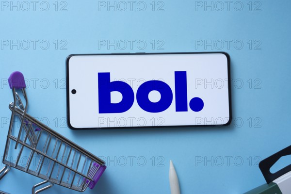 Dhaka, Bangladesh- 03 July 2025: Smartphone displaying bol logo with shopping cart on a blue