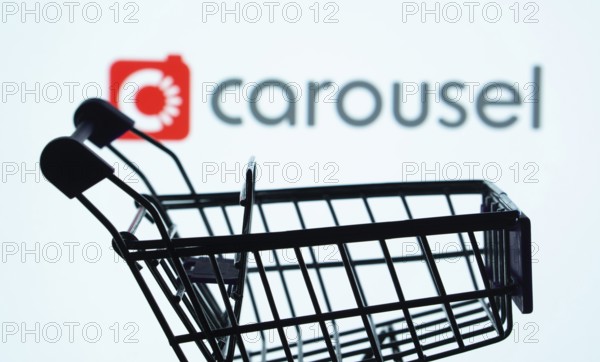 Dhaka, Bangladesh- 03 July 2025: Silhouette of a shopping cart in front of the Carousell logo,