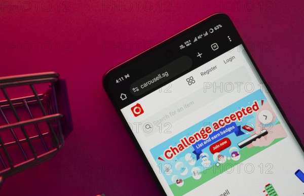 Dhaka, Bangladesh- 23 June 2025: A smartphone displaying the Carousell website with a shopping cart