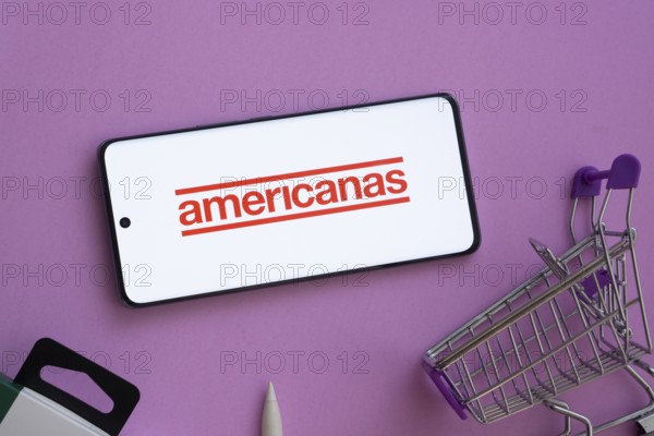 Dhaka, Bangladesh- 03 July 2025: Smartphone displaying Americanas logo alongside a shopping cart on