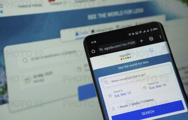 Dhaka, Bangladesh - 27 July 2025: The logo of Agoda is displayed on a smartphone screen, and the