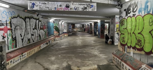 Graffiti-decorated tunnel with colorful murals and urban atmosphere, subway station, Lisbon,