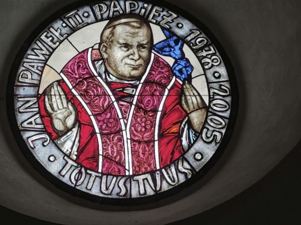 Religious motif, Pope John Paul 2 in a stained glass window in a small Polish village on the