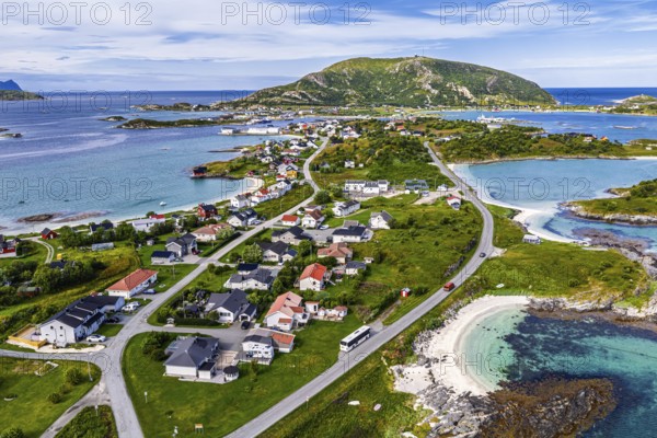 Aerial view over island Sommaroy, sandy beaches, mountain with radar station, Norway