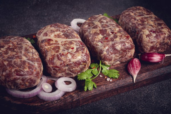Raw apkhazura, a dish of Georgian cuisine, meat balls, minced meat wrapped in a fat net, seftalia,