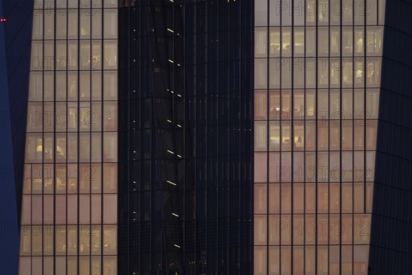The setting sun shines on the glass façade of the European Central Bank (ECB) in Frankfurt am Main,