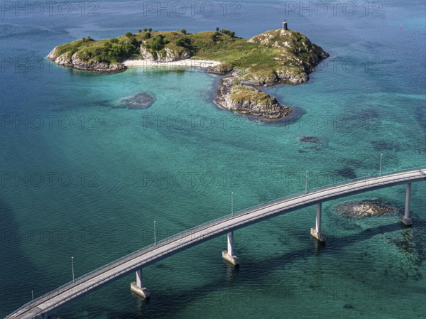 Sommaroy Bridge connecting Kvaloya Island to Sommaroy Island, small islands, turquoise water,