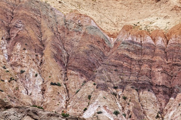 Colourful rocks with distinct rock layers that form an impressive geological formation, colorful
